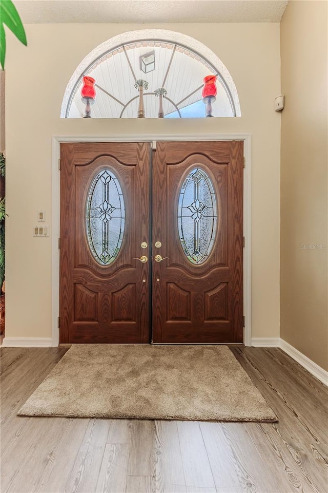 foyer with wood finished floors