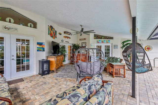 view of patio featuring french doors and a ceiling fan