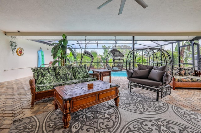 balcony featuring outdoor lounge area, a ceiling fan, and a sunroom
