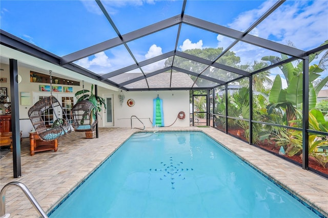 swimming pool featuring a patio area and a lanai