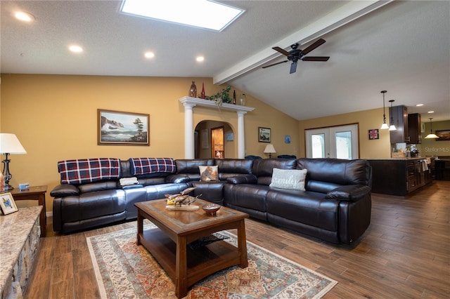 7550 Jomel Dr, Weeki Wachee, FL 34607 - living room with ceiling fan, dark wood finished floors, arched walkways, recessed lighting, and ornate columns