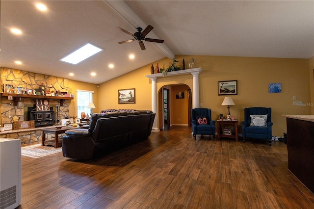 7550 Jomel Dr, Weeki Wachee, FL 34607 - living room with arched walkways, ceiling fan, dark wood-style floors, and recessed lighting