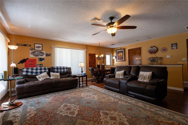 7550 Jomel Dr, Weeki Wachee, FL 34607 - living area featuring ceiling fan, a textured ceiling, wood finished floors, and a chandelier
