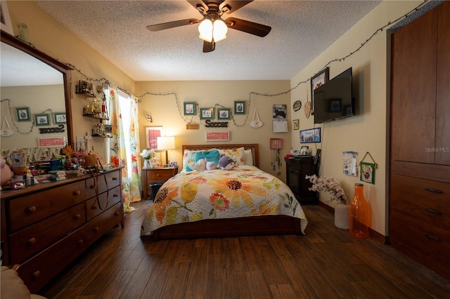 7550 Jomel Dr, Weeki Wachee, FL 34607 - bedroom featuring a textured ceiling, dark wood-style flooring, and a ceiling fan