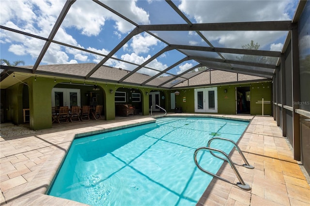 7550 Jomel Dr, Weeki Wachee, FL 34607 - swimming pool with french doors, a patio, and glass enclosure