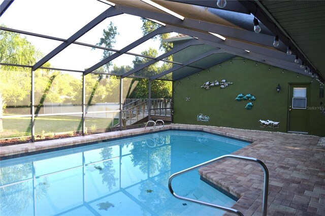 7550 Jomel Dr, Weeki Wachee, FL 34607 - outdoor pool featuring a patio and glass enclosure