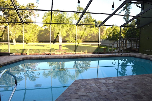 7550 Jomel Dr, Weeki Wachee, FL 34607 - swimming pool featuring a lanai and a lawn