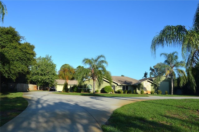 7550 Jomel Dr, Weeki Wachee, FL 34607 - ranch-style house with curved driveway