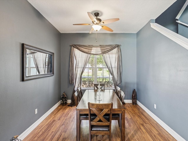 4481 Birchfield Loop, Spring Hill, FL 34609 - dining space with ceiling fan and wood finished floors