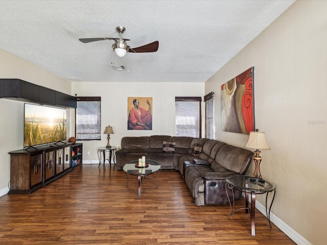 4481 Birchfield Loop, Spring Hill, FL 34609 - living area with wood finished floors, ceiling fan, plenty of natural light, and a textured ceiling