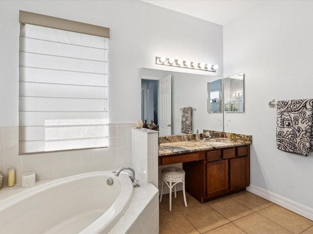 4481 Birchfield Loop, Spring Hill, FL 34609 - bathroom with a garden tub, vanity, and tile patterned flooring