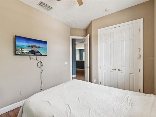 4481 Birchfield Loop, Spring Hill, FL 34609 - bedroom featuring wood finished floors, a closet, and a ceiling fan