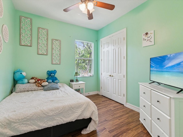 4481 Birchfield Loop, Spring Hill, FL 34609 - bedroom featuring wood finished floors, a closet, and a ceiling fan
