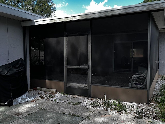 723 W Bayshore Dr, Tarpon Springs, FL 34689 - view of patio featuring a sunroom