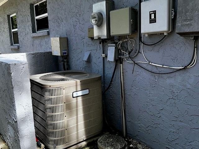 723 W Bayshore Dr, Tarpon Springs, FL 34689 - exterior view of a central air condition unit and electric meter