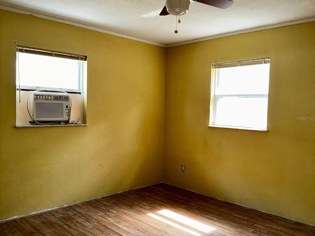 723 W Bayshore Dr, Tarpon Springs, FL 34689 - unfurnished room with a ceiling fan, crown molding, wood finished floors, and a textured wall