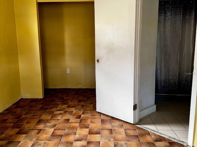 723 W Bayshore Dr, Tarpon Springs, FL 34689 - unfurnished bedroom with baseboards