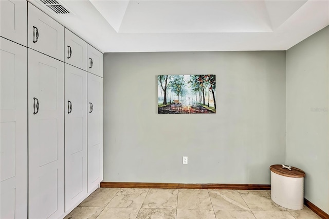 364 Waterfall Dr, Spring Hill, FL 34608 - unfurnished bedroom with baseboards and a raised ceiling
