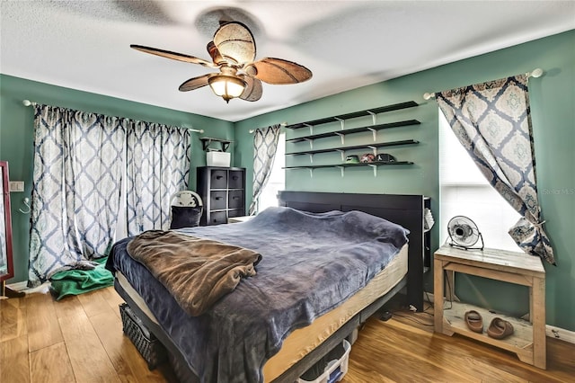 364 Waterfall Dr, Spring Hill, FL 34608 - bedroom featuring wood finished floors and a ceiling fan