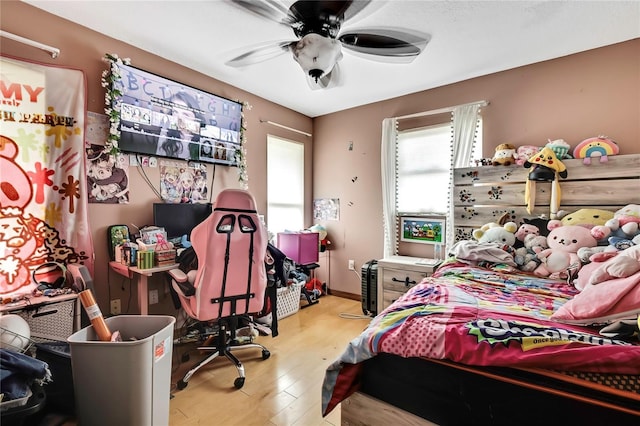 364 Waterfall Dr, Spring Hill, FL 34608 - bedroom with wood finished floors and ceiling fan