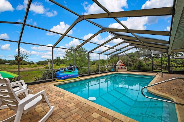 364 Waterfall Dr, Spring Hill, FL 34608 - swimming pool with a patio area and glass enclosure