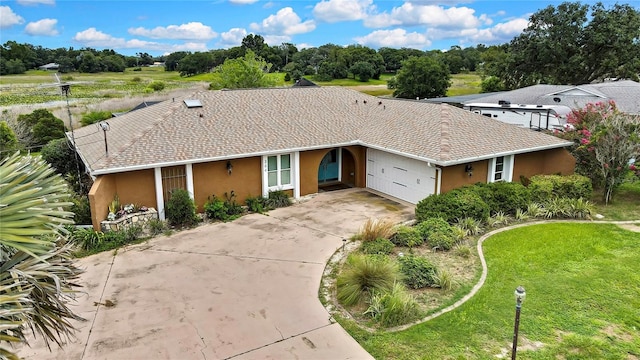 364 Waterfall Dr, Spring Hill, FL 34608 - ranch-style home with a garage, stucco siding, driveway, and a front yard