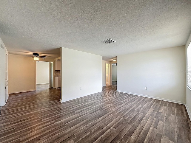 6341 Hyperion Dr, Port Richey, FL 34668 - spare room with dark wood finished floors, ceiling fan, and a textured ceiling