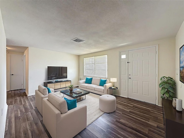 6341 Hyperion Dr, Port Richey, FL 34668 - living room featuring dark wood-style flooring and a textured ceiling