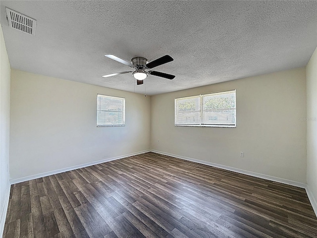 6341 Hyperion Dr, Port Richey, FL 34668 - unfurnished room featuring plenty of natural light, wood finished floors, a textured ceiling, and ceiling fan