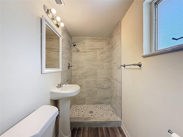 6341 Hyperion Dr, Port Richey, FL 34668 - full bath with a tile shower and wood finished floors
