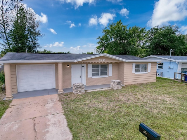 6341 Hyperion Dr, Port Richey, FL 34668 - ranch-style house featuring a garage, concrete driveway, a front yard, and brick siding