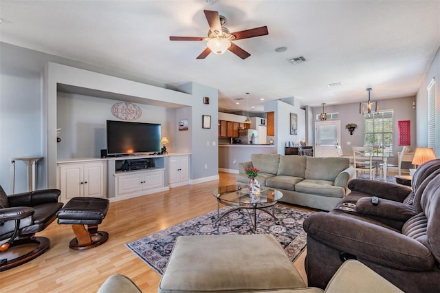 3450 Ferrell St, New Port Richey, FL 34655 - living area with light wood-style floors and ceiling fan