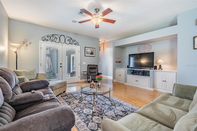 3450 Ferrell St, New Port Richey, FL 34655 - living area featuring french doors, a ceiling fan, and light wood-style flooring