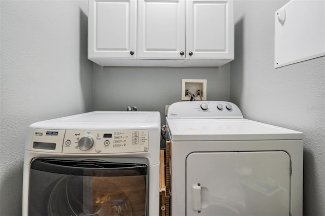 3450 Ferrell St, New Port Richey, FL 34655 - washroom with cabinet space and washing machine and clothes dryer