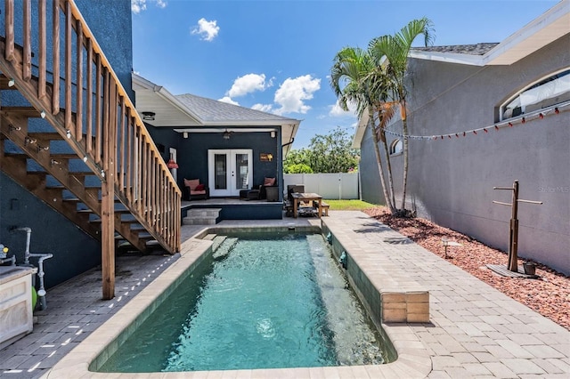 3450 Ferrell St, New Port Richey, FL 34655 - view of pool featuring french doors, stairs, a fenced backyard, and a patio area