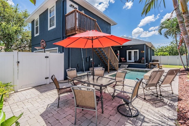 3450 Ferrell St, New Port Richey, FL 34655 - patio / terrace with a fenced backyard, stairway, french doors, a gate, and a patio