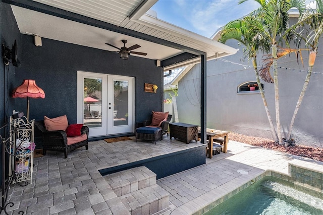 3450 Ferrell St, New Port Richey, FL 34655 - view of patio with french doors, a ceiling fan, and an outdoor pool