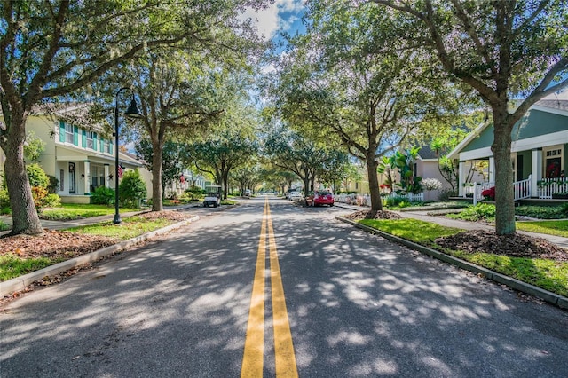 3450 Ferrell St, New Port Richey, FL 34655 - view of asphalt road with sidewalks, curbs, and a residential view