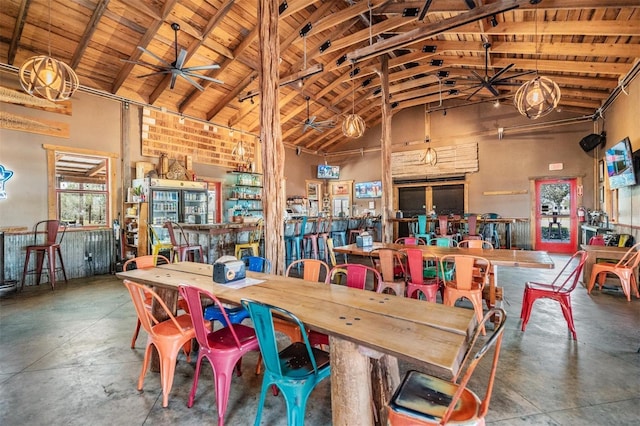 3450 Ferrell St, New Port Richey, FL 34655 - dining room featuring high vaulted ceiling, concrete floors, a ceiling fan, and a wooden ceiling with exposed beams