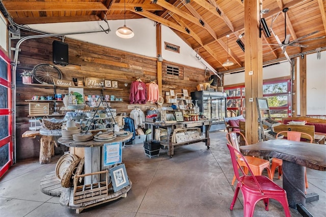 3450 Ferrell St, New Port Richey, FL 34655 - misc room featuring wood walls, high vaulted ceiling, concrete floors, and a wooden ceiling with exposed beams
