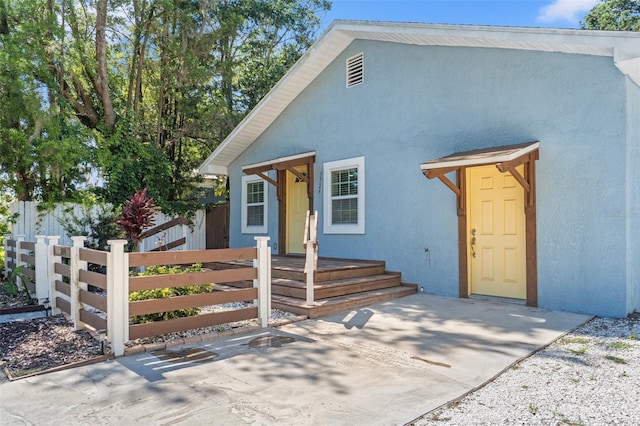5724 Casson Ave, New Port Richey, FL 34652 - view of front of property featuring a fenced front yard and stucco siding
