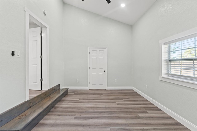 5724 Casson Ave, New Port Richey, FL 34652 - empty room with high vaulted ceiling, ceiling fan, and wood finished floors