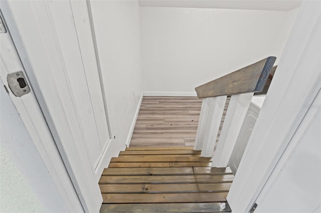 5724 Casson Ave, New Port Richey, FL 34652 - stairway featuring wood finished floors and baseboards