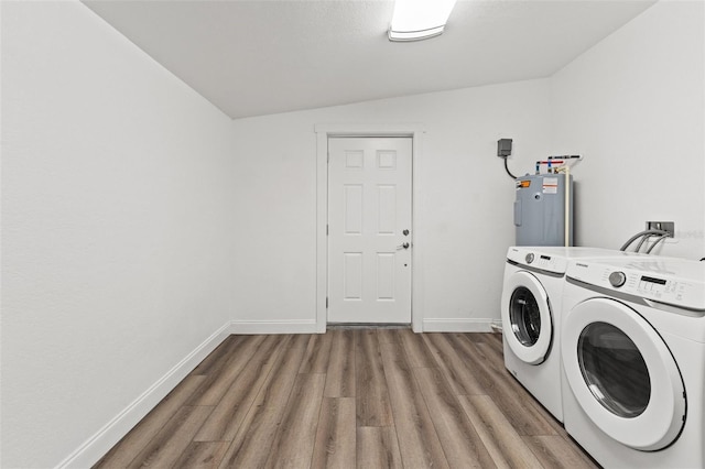 5724 Casson Ave, New Port Richey, FL 34652 - laundry room featuring water heater, independent washer and dryer, and wood finished floors