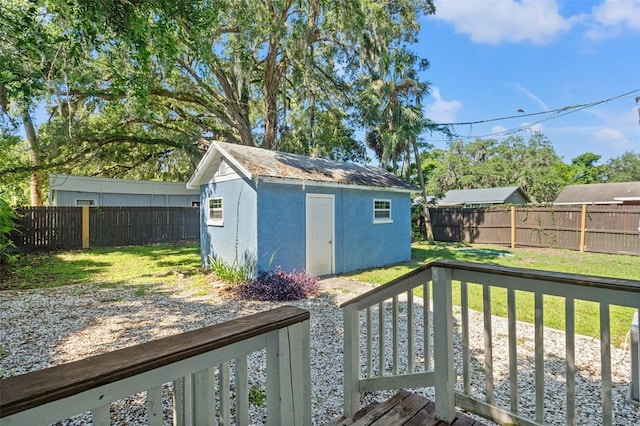 5724 Casson Ave, New Port Richey, FL 34652 - wooden deck featuring a fenced backyard and a storage unit