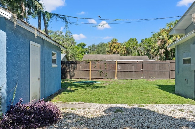 5724 Casson Ave, New Port Richey, FL 34652 - fenced backyard featuring a patio