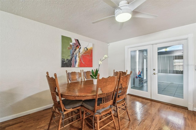 1071 Lexington Ct, Largo, FL 33771 - dining space featuring french doors, wood finished floors, a ceiling fan, and a textured ceiling