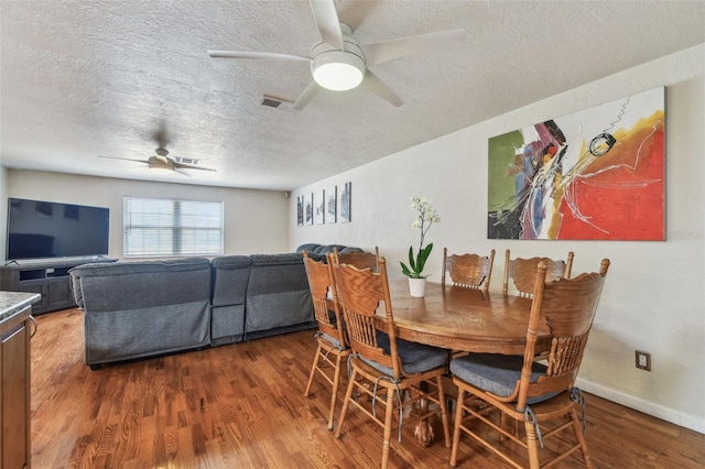 1071 Lexington Ct, Largo, FL 33771 - dining space featuring ceiling fan, a textured ceiling, and wood finished floors