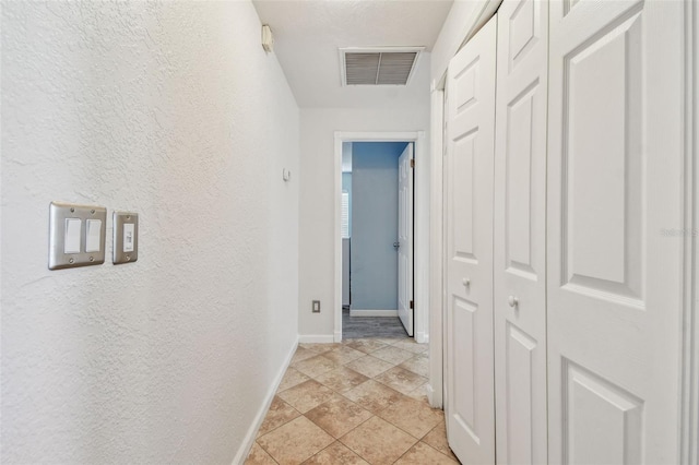 1071 Lexington Ct, Largo, FL 33771 - hall with baseboards and a textured wall