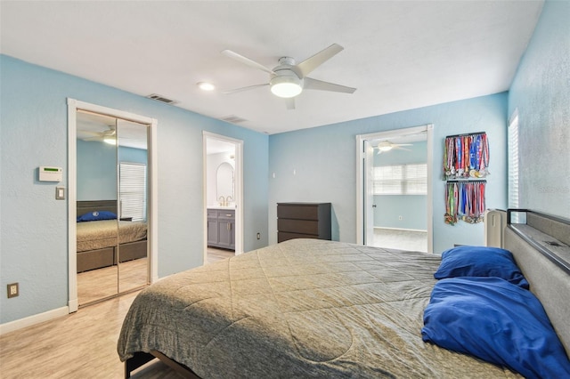 1071 Lexington Ct, Largo, FL 33771 - bedroom featuring light wood-style flooring, ceiling fan, and ensuite bathroom